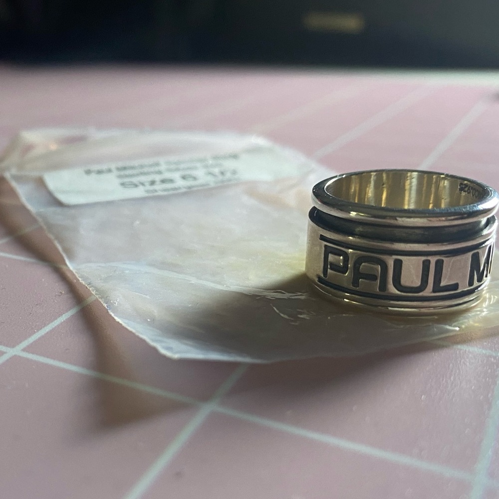Paul Mitchell stainless steel spinner ring NEW *
